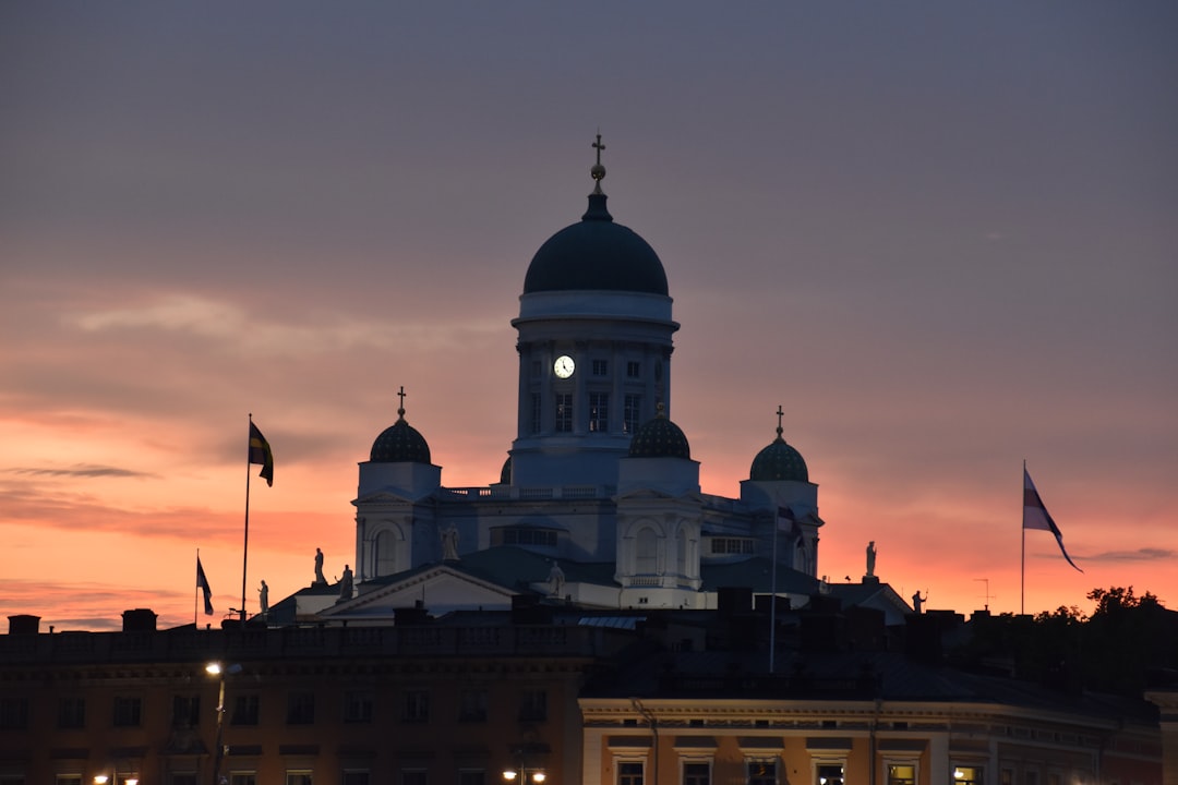 white and black concrete building during sunset